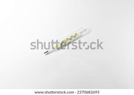 a thermometer measuring body temperature. isolated on white background