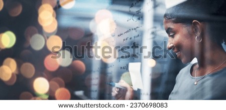 Happy woman, writing and schedule planning at night on glass board for strategy or ideas at office on bokeh background. Female person smile working late on project plan, tasks or agenda at workplace
