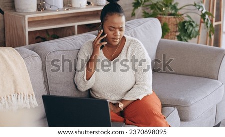 Laptop, phone call and worry with a black woman on a sofa in the living room of her home for problem solving. Computer, communication and a concerned person talking on her mobile for networking Royalty-Free Stock Photo #2370698095