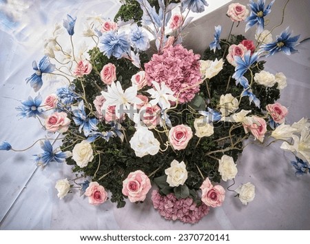 A bunch of flowers sitting on top of a table, decorative flowers, floral design, Beautiful picture of flowers and leaves.
