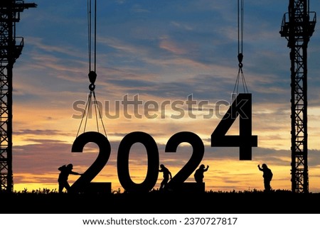 Silhouette of staff as a team to prepare to welcome the 2024,Happy New Year 2024,Construction 2024 concept  Royalty-Free Stock Photo #2370727817