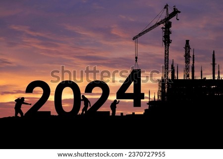 Silhouette of staff as a team to prepare to welcome the 2024,Happy New Year 2024,Construction 2024 concept 