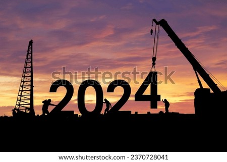 Silhouette of staff as a team to prepare to welcome the 2024,Happy New Year 2024,Construction 2024 concept  Royalty-Free Stock Photo #2370728041