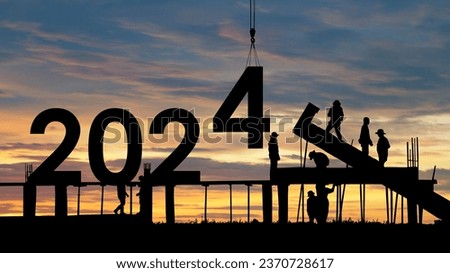 Construction 2024 concept ,Silhouette of staff as a team to prepare to welcome the 2024.Happy New Year 2024 Royalty-Free Stock Photo #2370728617