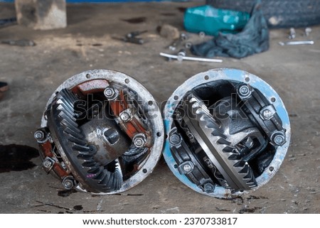 service car differential repair,car gearbox,new vs old differential,truck differential. Royalty-Free Stock Photo #2370733817