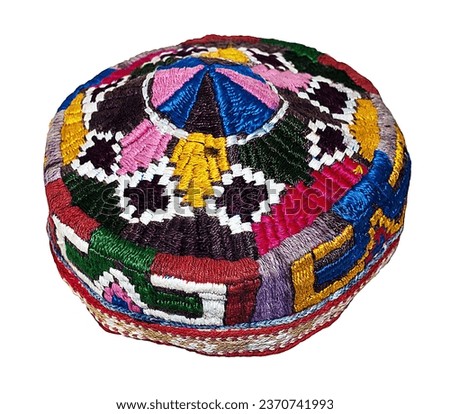 Multicolored Uzbek skullcap with floral pattern.Oriental headdress on a white background. Royalty-Free Stock Photo #2370741993