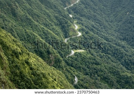 Winding road, top view of beautiful aerial view of asphalt road, highway through forest. Banner panorama background