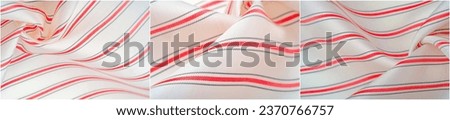 White silk fabric with red and gray stripes Narrow stripe design adds a touch of elegance Stroke texture creates visual interest Can be used as a backdrop for various projects or designs