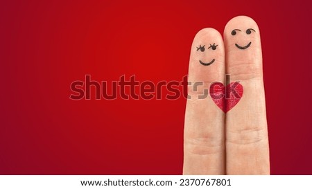 two fingers with smiley faces and hearts on them Royalty-Free Stock Photo #2370767801