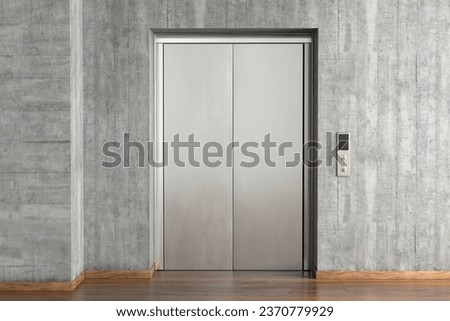 Blank plain metallic silver elevator door for branding with concrete wall Royalty-Free Stock Photo #2370779929