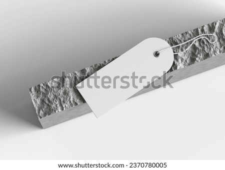 White Plain Empty Hanging Label Price Tag Placed on a Stone and on isolated Background