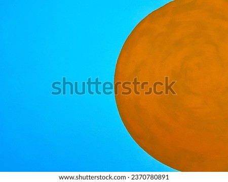 Yellow circle on a blue background. Royalty-Free Stock Photo #2370780891