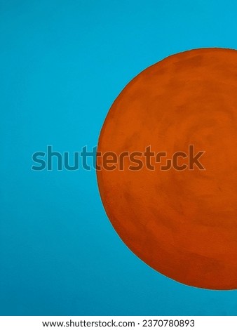 Yellow circle on a blue background. Royalty-Free Stock Photo #2370780893