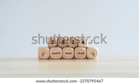 Happy New Year 2024 on wooden cubes for background New Year holiday card. calendar 2024 for design card, poster, template, and banner