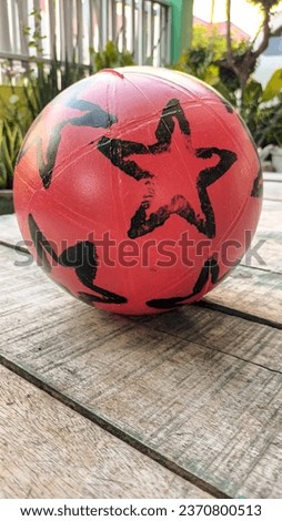 Red football made of plastic