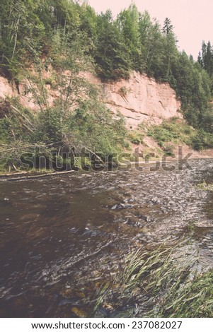 Mountain river with Flowing Water Stream and sandstone cliffs - retro, vintage style look