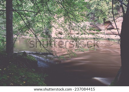 Mountain river with Flowing Water Stream and sandstone cliffs - retro, vintage style look