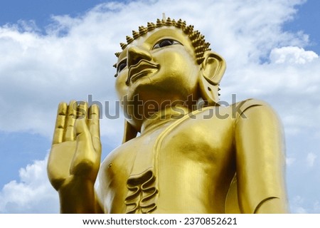 Golden Buddha Statue Sculpture, architecture and symbols of Buddhism, South East Asia at Phrae Province Northern Thailand.