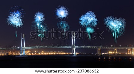 Fireworks celebrating over Yokohama Bay Bridge at night, Japan