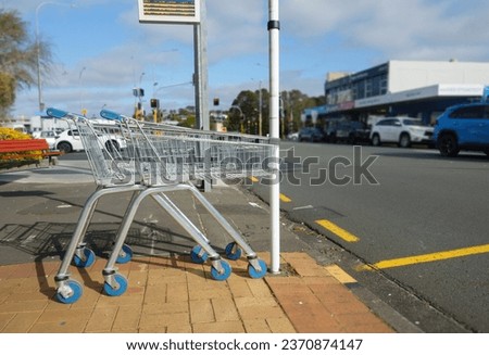 Shopping trolleys abandoned at bus stop. 