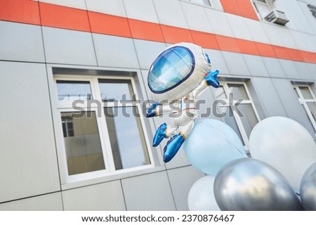 Balloons in the form of an astronaut. Children's birthday party, discharge from the maternity hospital. Event decor