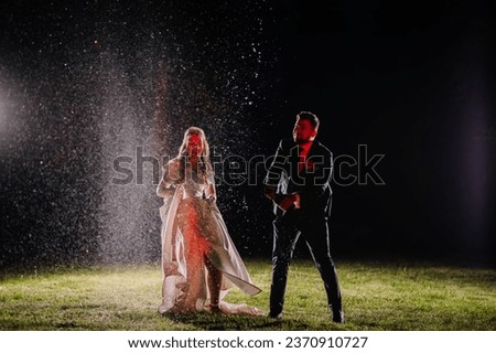 night picture, where the bride and groom open champagne and everything goes in the air