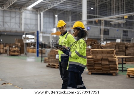Cardboard manufacturing data analysts collaborate to enhance database and data mining, boosting factory performance through upgrades, troubleshooting for competitive advantages in the AI industry era Royalty-Free Stock Photo #2370919951