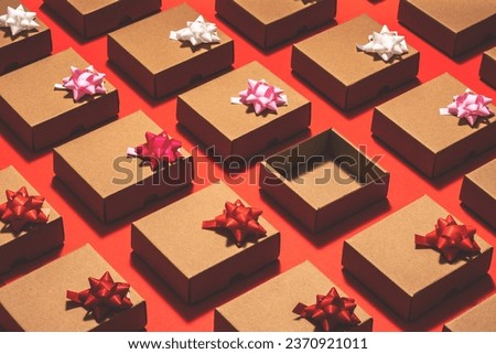 Kraft paper gift boxes flat lay. Empty box on red background