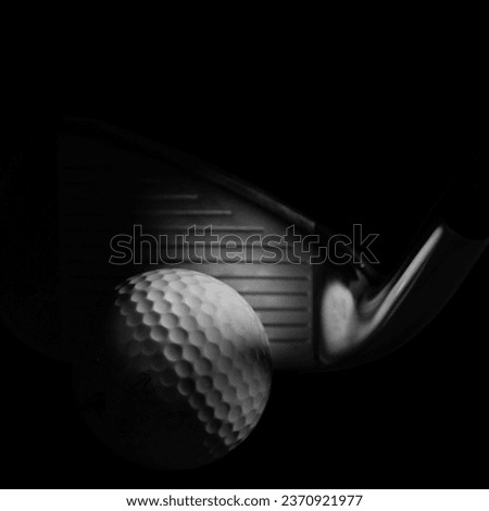 Moody Golf Concept on a Black Background showing Iron Club Face and Ball