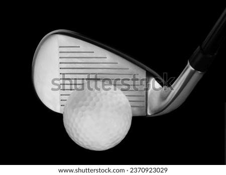 Closeup of a Iron Golf Club Iron Head with Ball on a Black Background, full screen Studio Shot