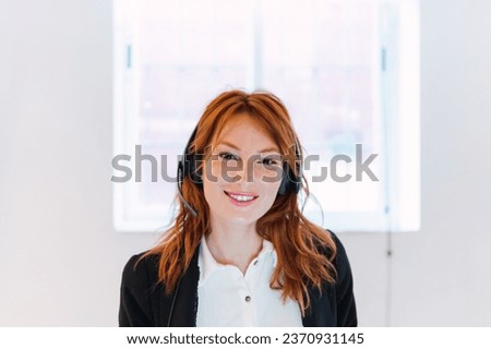 Customer service, woman and happy call center agent giving advice online using a headset. Operator, telemarketing and support with hotline consultant working for contact us help or arm consulting Royalty-Free Stock Photo #2370931145