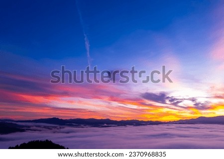 Amazing Sunrise or sunset over mountains hills covered with mist, Aerial view landscape drone shot beautiful colorful nature background