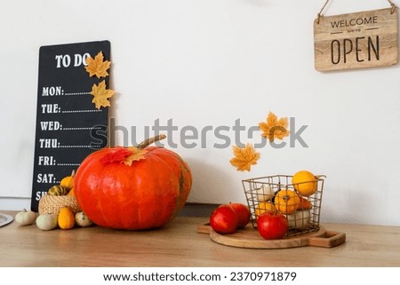 Kitchen counter with Halloween pumpkins in festive kitchen