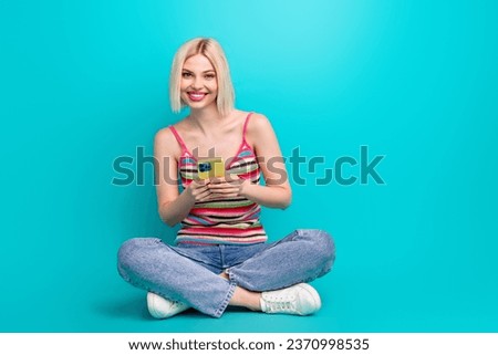 Full length photo of shiny sweet lady wear singlet chatting instagram twitter telegram facebook empty space isolated turquoise color background