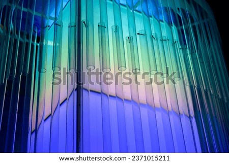 Close-up Neon colorful light on blue and black shadow background,Abstract background neon pastel light and line,beautiful blue light,
,architecture lights,Beautiful lamp,pastel and minimal colours.