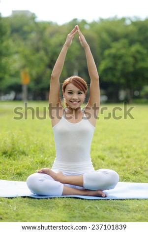 Young sport girl do yoga in the park, asian beauty woman