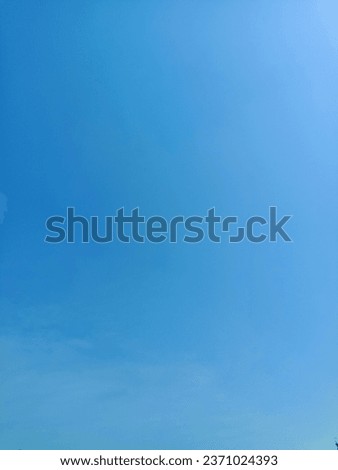 a beautiful view of the blue sky covered in thin clouds during a summer day