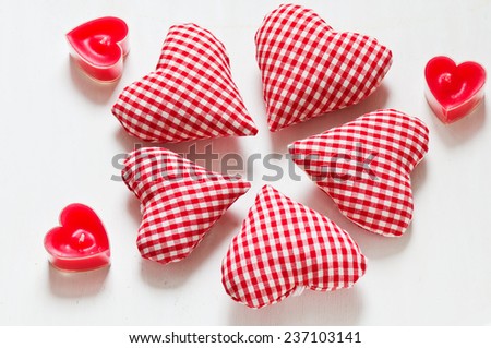Red valentine's hearts with candes on white backgraunds