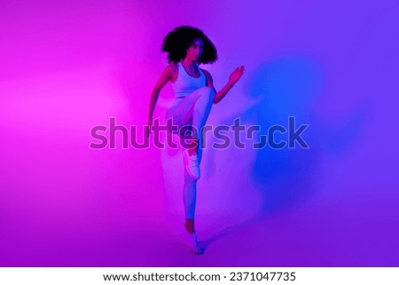 Full body photo of young serious athlete runner girl marathon sportive woman leggings jump top isolated on neon blue pink background