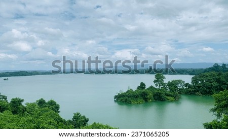 Wonderful riverside scenery in the lake. island views in riverside. Riverine county of world. Evergreen natural photography. Natural photo background for editorial or commercial use both.