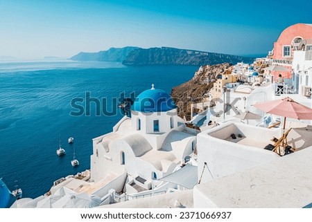 Oia views, an iconic sunset feature of the Greek island of Santorini in Cyclades Archipelago, Aegean Sea, Greece. Royalty-Free Stock Photo #2371066937