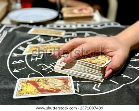 Fortune telling with tarot cards Royalty-Free Stock Photo #2371087489