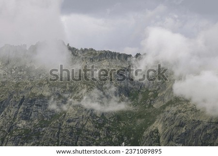 Swiss mountains and lakes  in the clouds 