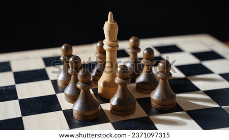 Defeat. The white king is surrounded by black pawns. A hopeless situation Royalty-Free Stock Photo #2371097315