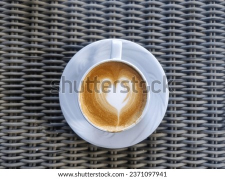 View of coffee cup with latte art straight from above