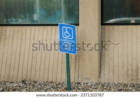 handicap wheelchair-accessible sign against a blurred background symbolizing inclusivity, disability rights, and accessible spaces