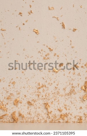Paper texture glow painting blot wall. Abstract gold, nacre and beige copy space background.
