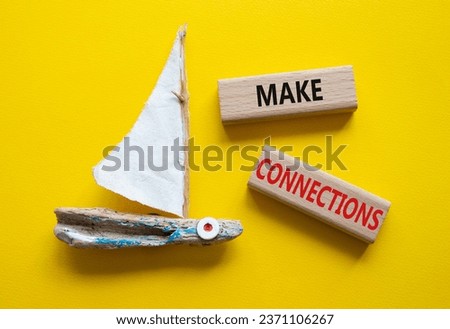 Make Connections symbol. Concept word Make Connections on wooden blocks. Beautiful yellow background with boat. Business and Make Connections concept. Copy space