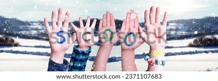 Children Hands Building Colorful English Word School. White Winter Background With Snowflakes And Snowy Landscape.