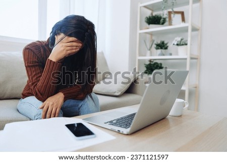 Woman working from home freelance in laptop online, overwork and fall depression